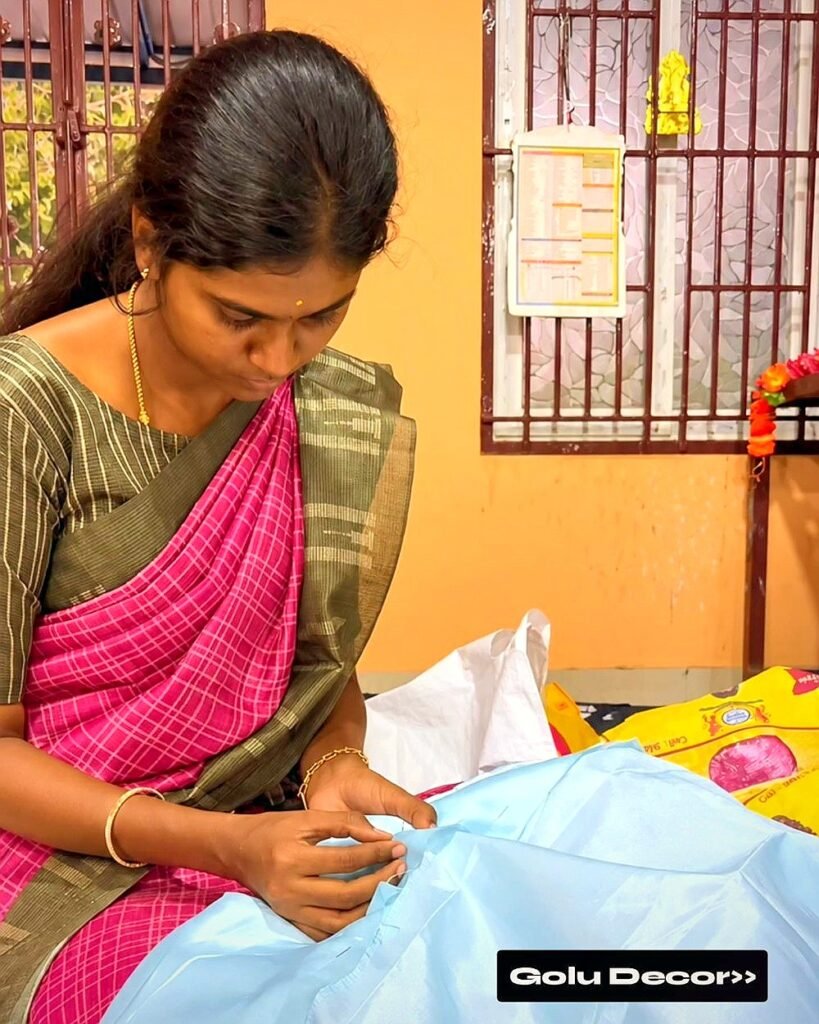 Bhuvi, founder and artist, hand-finishing a personalised gift