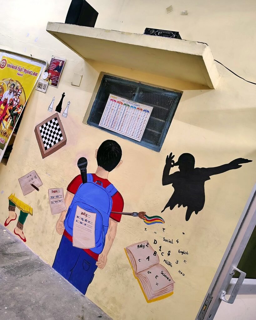 Government school wall painting with learning themes