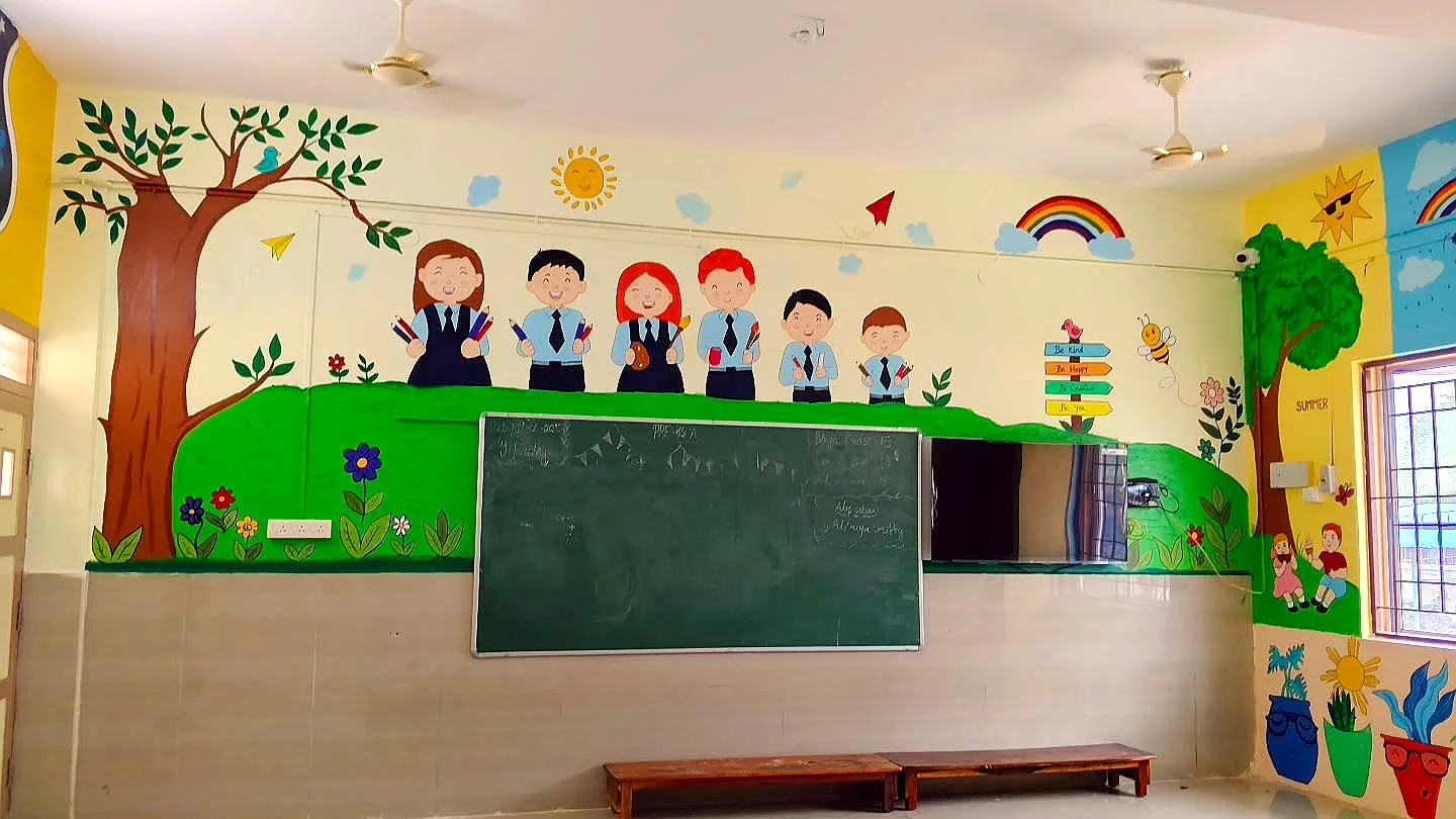 Painted school children in uniform above the chalkboard — classroom at Sri Krishnasamy International CBSE School, Sivakasi